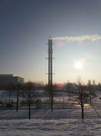 View of snow covered landscape at sunset