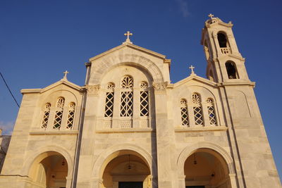 Low angle view of cathedral and building against sky