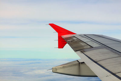 Airplane wing against sky