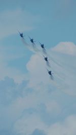 Low angle view of airplane flying in sky