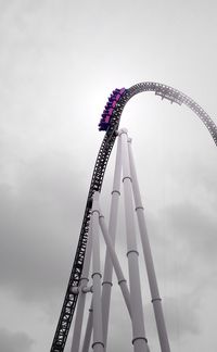 Low angle view of ferris wheel against sky