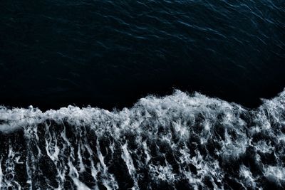 High angle view of water flowing over sea