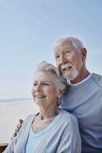 Smiling senior couple on the beach