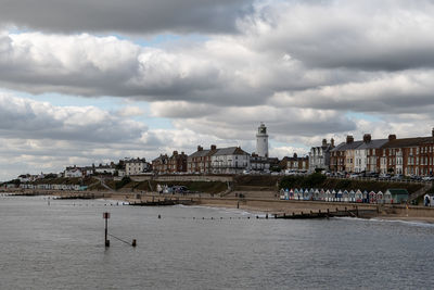 Panoramic view of sea and buildings against sky