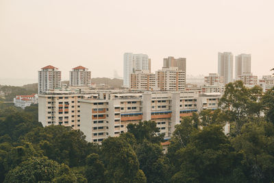 View of apartment blocks in city against clear sky