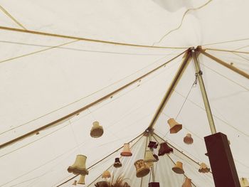 Low angle view of ropes hanging against the sky