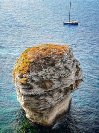 High angle view of rock formation in sea