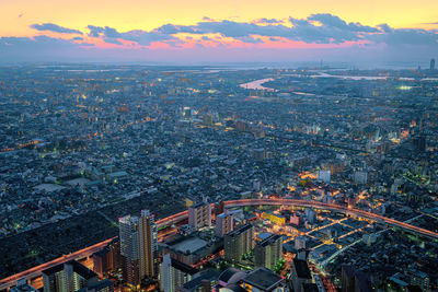 High angle view of city during sunset