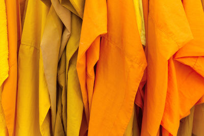 Full frame shot of orange decorations hanging in store