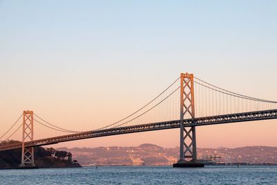 View of suspension bridge at sunset