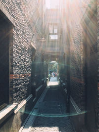 Street amidst buildings seen through window