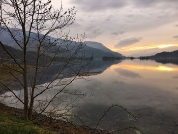 Scenic view of lake against sky during sunset