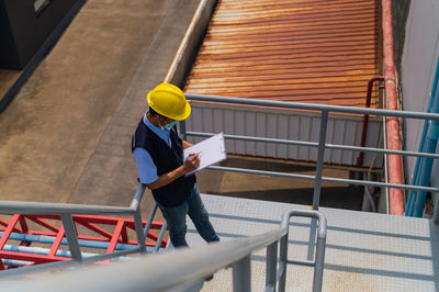 Man working on railing