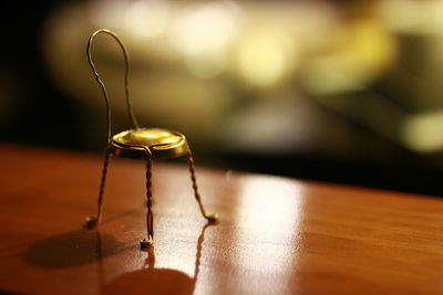 Close-up of metallic hair on wooden table