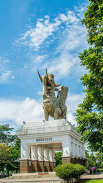 Low angle view of statue against sky