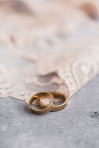 Studio shot of pair of golden wedding rings