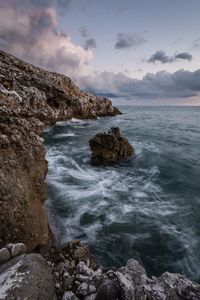 Scenic view of sea against cloudy sky