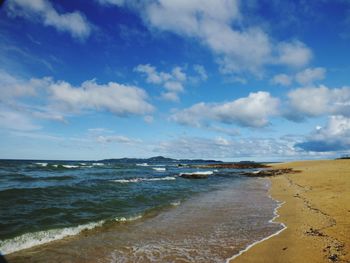 Scenic view of beach against sky