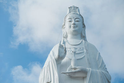 Low angle view of statue against sky