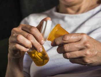 Close-up of man holding bottle