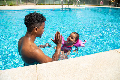 High angle view of woman swimming in pool