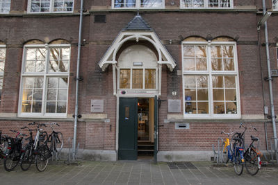 Bicycles on street against building