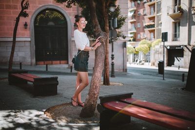 Woman standing on city street