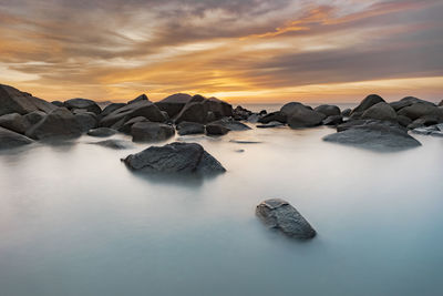 Scenic view of sea against sky during sunset