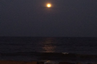 Scenic view of sea against sky at night