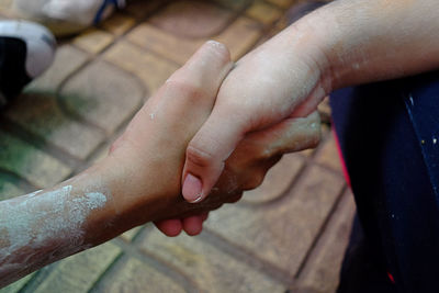 Cropped image of people giving handshake