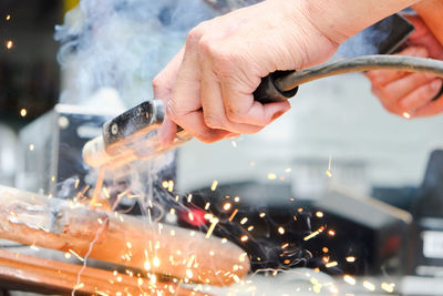 Close-up of man working in factory