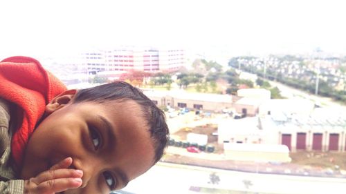 Close-up of woman in front of building