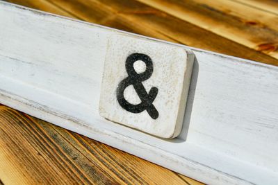 High angle view of symbol on wooden table