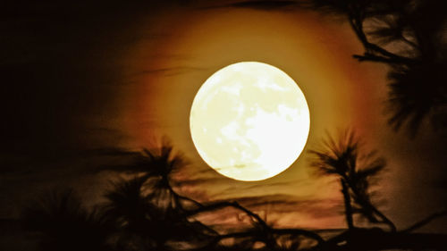 Scenic view of moon against sky at sunset