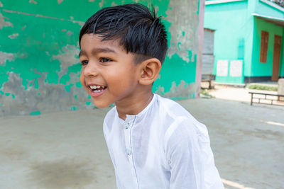 Portrait of boy standing outdoors