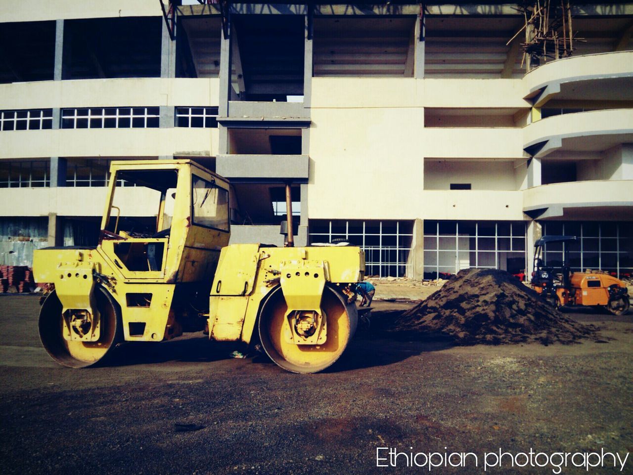 building exterior, architecture, built structure, construction site, transportation, mode of transport, land vehicle, day, no people, outdoors, road, city