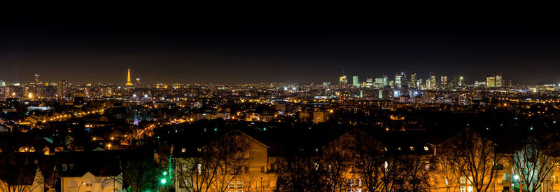 Illuminated buildings in city at night