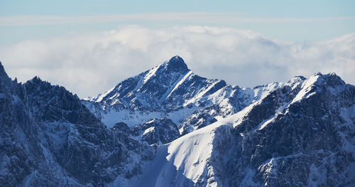 Scenic view of snowcapped mountains against sky