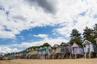 Houses on beach against sky