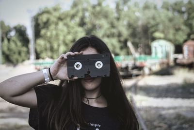 Portrait of woman photographing