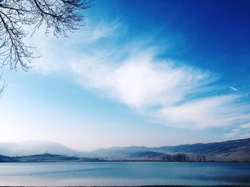 Scenic view of lake against cloudy sky