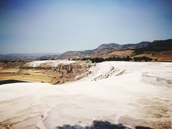 Scenic view of desert against clear sky