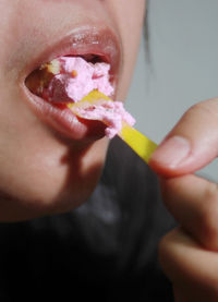 Cropped image of woman eating apple