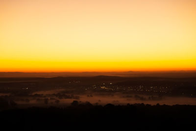 Scenic view of silhouette landscape against sky during sunset