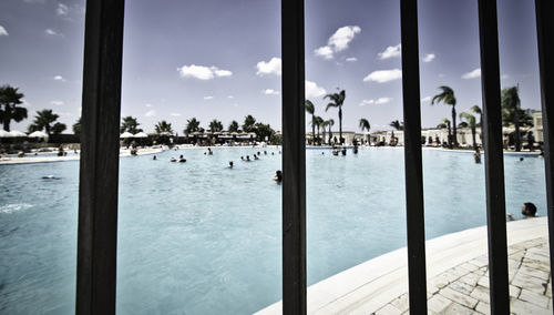 Scenic view of sea against sky seen through window