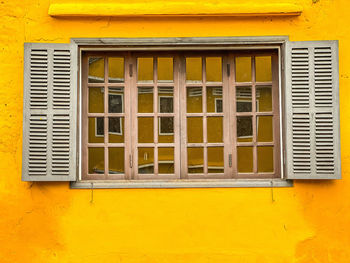 Yellow house wall and door window