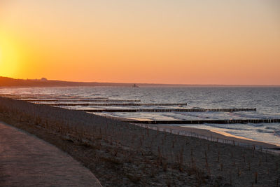 Scenic view of sea against clear sky during sunset