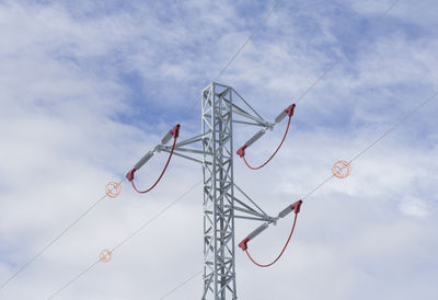 Low angle view of telephone pole against sky