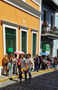 People standing on street in city