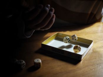 High angle view of man using smart phone on table